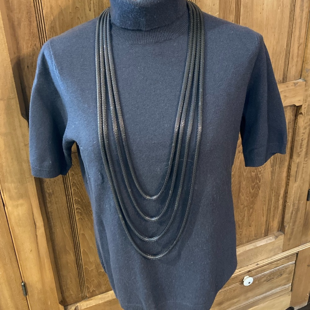 Artisan multi-strand silver-tone metal necklace.